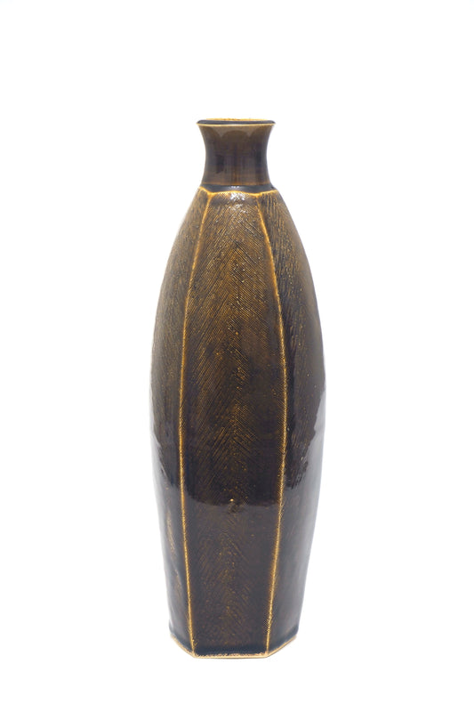 Tall brown bottle faceted